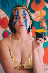 Obraz na płótnie Canvas girl with her face painted blue