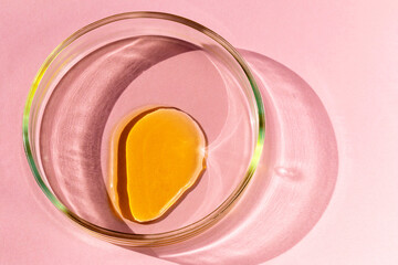 Orange liquid in a petri dish