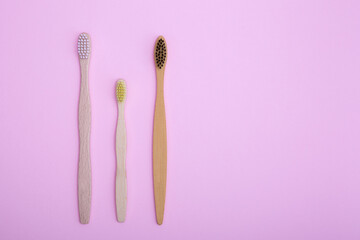Eco-friendly wooden bamboo toothbrushes for adults and children. The concept of sustainability, no...