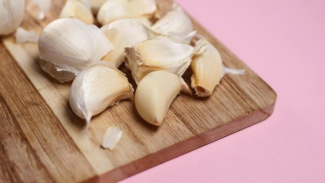 close up pf garlic on pink background,
