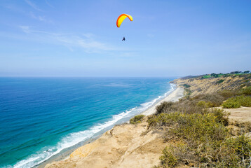 Paraglider Over California Ocean Background