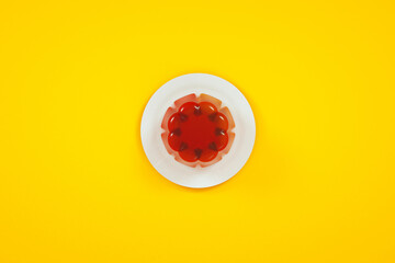 Fototapeta premium red jelly pudding on plate, 3d render, flat lay