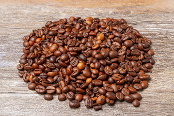 Coffee beans on wooden table background