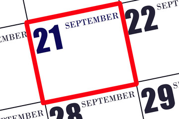 Date 21 September in a frame on the calendar, mockup, copy space. Calendar for September. Autumn month, day of the year concept.