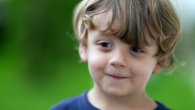 Child grimacing to camera cute little boy portrait growling