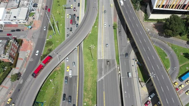 View from a drone of the highway in the city with cars and public transport called transmilenio to bridges of different levels. Bogota. Colombia.