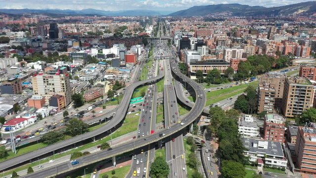 View from a drone of the highway in the city with cars and public transport on bridges of different levels. December 21, 2022. Bogotá. Colombia.