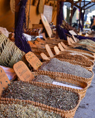 Pollensa, Mallorca, Spain - 12 Nov 2022: Dried herbs and spices on sale on a market stall in Pollensa