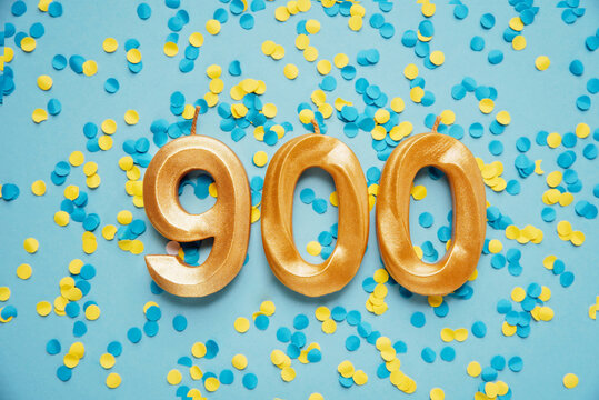900 nine hundred followers subscriber card. golden birthday candle on yellow and blue confetti Festive Background. Template for social networks, blogs. media celebration banner. online community fans
