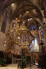 Fototapeta na wymiar Palma de Mallorca, Spain - 10 Nov 2022: Gaudi designed Altar in the Palma Seo Cathedral Basilica