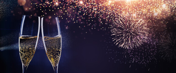 new year background with champagne glasses and fireworks