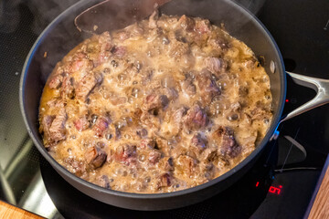 the meat is stewed in a pan