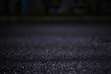 water drops on wet pavement at night