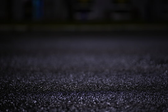 Water Drops On Wet Pavement At Night