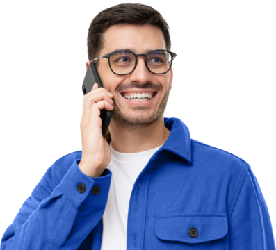 Cheerful young man in blue shirt and glasses, talking on the phone and laughing to friend's joke
