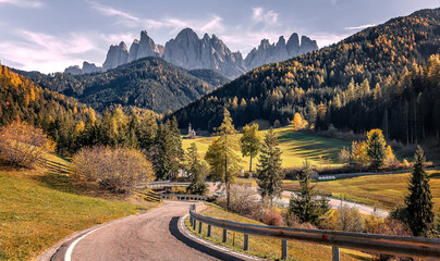 Stunning alpine Landscape at autumn. Santa Maddalena one of the most popular photo spot of Dolomite. Famous World place. Dolomites Alps. Italy. Amazing Nature background. Vivid landscape in fall
