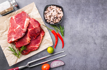 Fresh beef steak on a concrete background