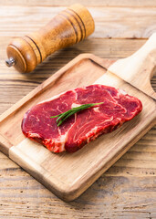 Fresh beef steak on a concrete background