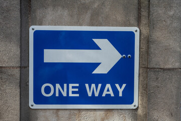 One way sign with arrow and two eyes