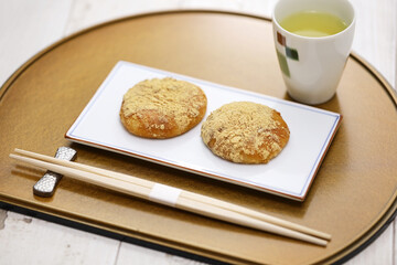 Kinako Mochi ( rice cakes coated with mixed powder roasted soybean flour and sugar), a Japanese dessert