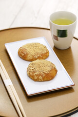 Kinako Mochi ( rice cakes coated with mixed powder roasted soybean flour and sugar), a Japanese dessert