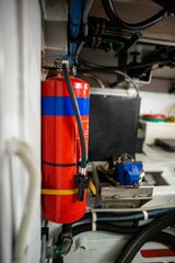 fire extinguisher in the engine room of a boat
