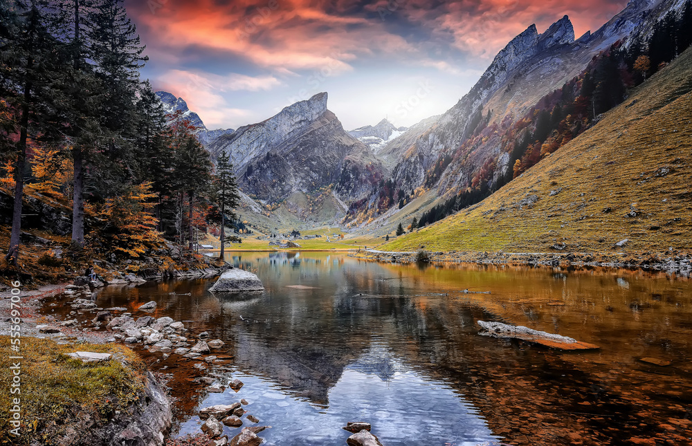 Fototapete Colorful autumn landscape in the mountains. Lake Seealpsee near Appenzell in swiss Alps. Awesome alpine highlands in sunny day, Colorful sky Oner the Swiss Alps, Switzerland. Picture of a Wild Area.