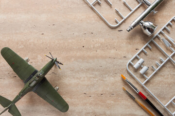 Scale model of the airplane fighter with details. Plastic assembly kit. Top view.  Small depth of field 