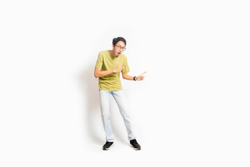 Single skinny young male. The full body of an Asian or Indonesian person. Isolated photo studio with white background.