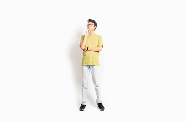 Fototapeta premium Single skinny young male. The full body of an Asian or Indonesian person. Isolated photo studio with white background.
