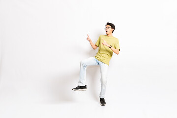 Single skinny young male. The full body of an Asian or Indonesian person. Isolated photo studio with white background.