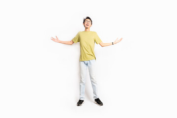 Single skinny young male. The full body of an Asian or Indonesian person. Isolated photo studio with white background.