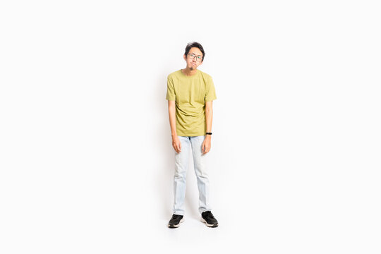 Single Skinny Young Male. The Full Body Of An Asian Or Indonesian Person. Isolated Photo Studio With White Background.