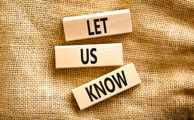 Let us know symbol. Concept words Let us know on wooden blocks on a beautiful canvas table canvas background. Business and let us know concept. Copy space.