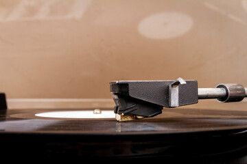 Fototapeta na wymiar Close up of turntable needle on a vinyl