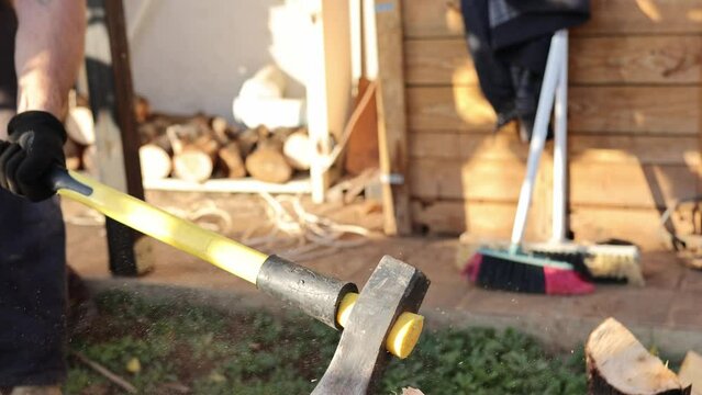 Man chopping woods with ax in countryside close up. lumber Man cutting woods, winter, cold, firewood