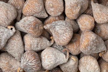 Sweet dried small spanish figs close up full frame as background 