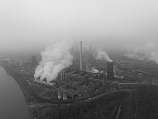 Ruhr area, Heavy industrial area near Dusseldorf. Coal mines, blast furnaces, steel mills, German industrial engineering and steel production. Aerial drone overhead view.