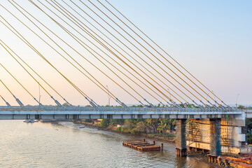 Obraz premium Cortalim, Goa - India - Dec 22nd 2022: New Zuari Bridge will be inaugurated on 29th December 2022 by Mr. Nitin Gadkari. Twin 4 Lane Zuari Bridge undertaken by Dilip Buildcon Ltd.