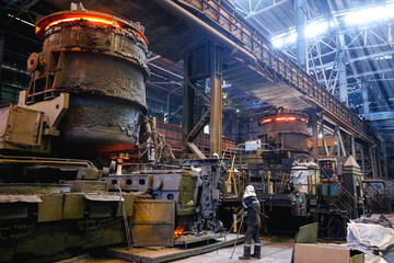 View from inside the shop of a steel mill. Ladle of hot metal at a large metallurgical plant....