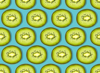 Colorful fruit pattern of fresh kiwi slices on blue background. Top view