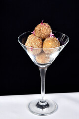 Handmade brazilian sweets: Beijinho and Brigadeiro. Common in children birthday party. Macro, close up