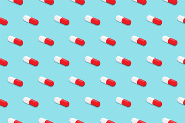 Pharmaceutical medicine pills. Capsule pattern isolated on blue background. Medicine creative concept