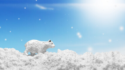 Polar bear in the snow. Bear figurine in winter. Winter landscape with a bear. Postcard winter. Snow, winter sky.
