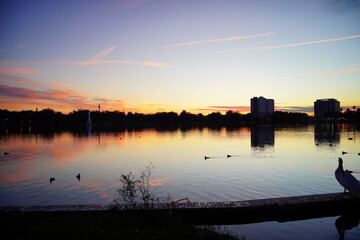Fototapeta premium Sunset landscape Lake Morton at city center of lakeland Florida 