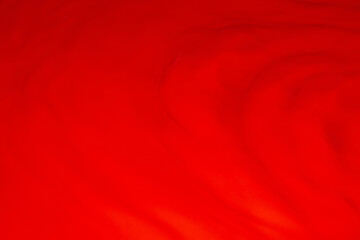 Red liquid, waves, fluidity.