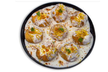 popular sweet spicy north indian chaat item dahi puri, dahi poori, dahi batata puri, dahi bhalle, gol gappa stuffed with potato, yogurt, sev, sprouts