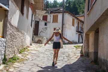 Typical narrow Greek streets and architecture with country side houses style in small village named Potamia at Thasos island, South-East from Thessaloniki 