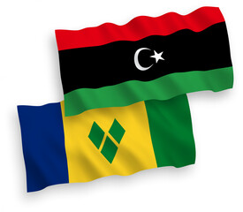 Flags of Saint Vincent and the Grenadines and Libya on a white background