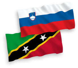 Flags of Slovenia and Federation of Saint Christopher and Nevis on a white background